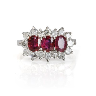 Lot 191 - An 18ct white gold ruby and diamond triple cluster ring