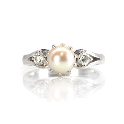 Lot 175 - A pearl and diamond three stone ring