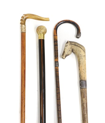 Lot 322 - Two gilt mounted walking sticks