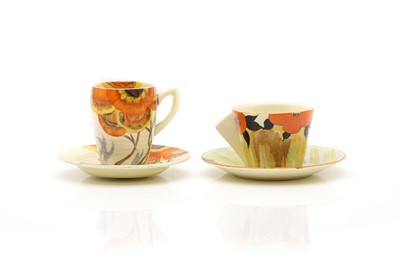 Lot 128 - Two Clarice Cliff pottery cups and saucers