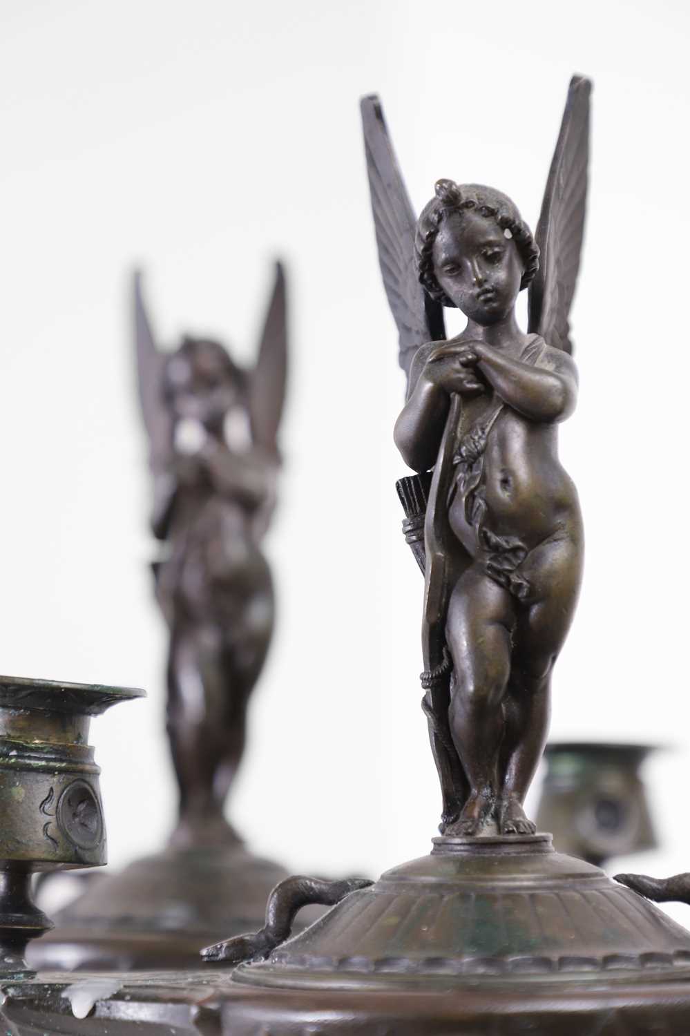 Lot 103 - A pair of bronze two-light candelabra