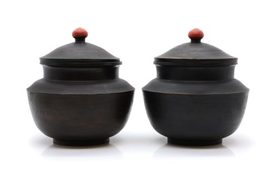 Lot 283 - A pair of stained wooden grain storage pots