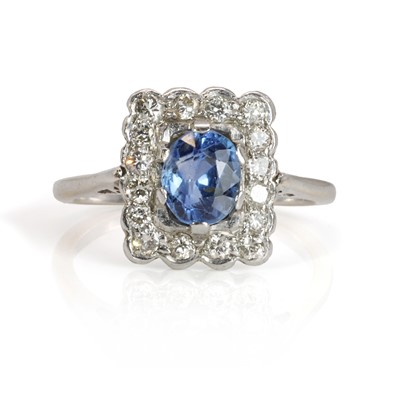 Lot 208 - A white gold sapphire and diamond cluster ring