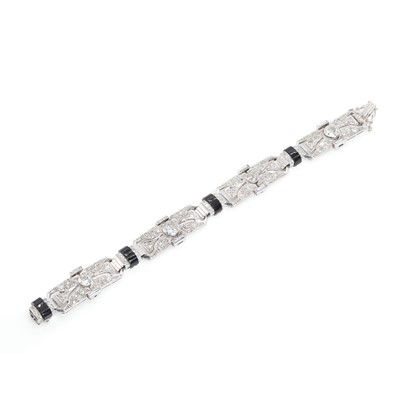 Lot 69 - An Art Deco diamond and onyx bracelet