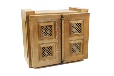 Lot 388 - An art-deco style limed oak spice cupboard