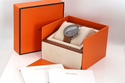 Lot 435 - A gentlemen's stainless steel and titanium Hermès Arceau quartz strap watch