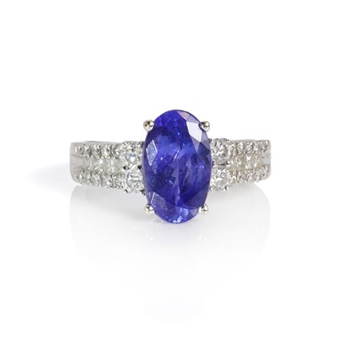 Lot 273 - An 18ct white gold tanzanite and diamond ring