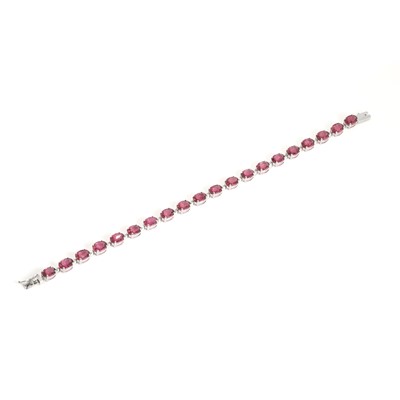 Lot 280 - A 9ct white gold, pink tourmaline and diamond line bracelet