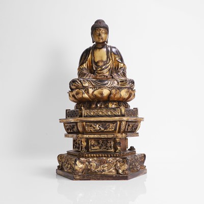 Lot 279 - A Japanese gilt-lacquered wood Buddha