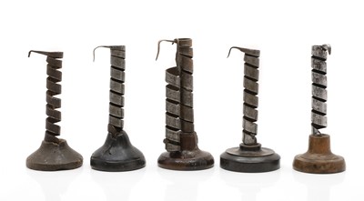 Lot 499 - A collection of six iron candlesticks