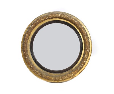 Lot 410 - A William IV gilt gesso framed circular convex mirror