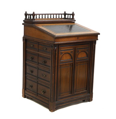 Lot 624 - A walnut and ebonised gothic revival davenport