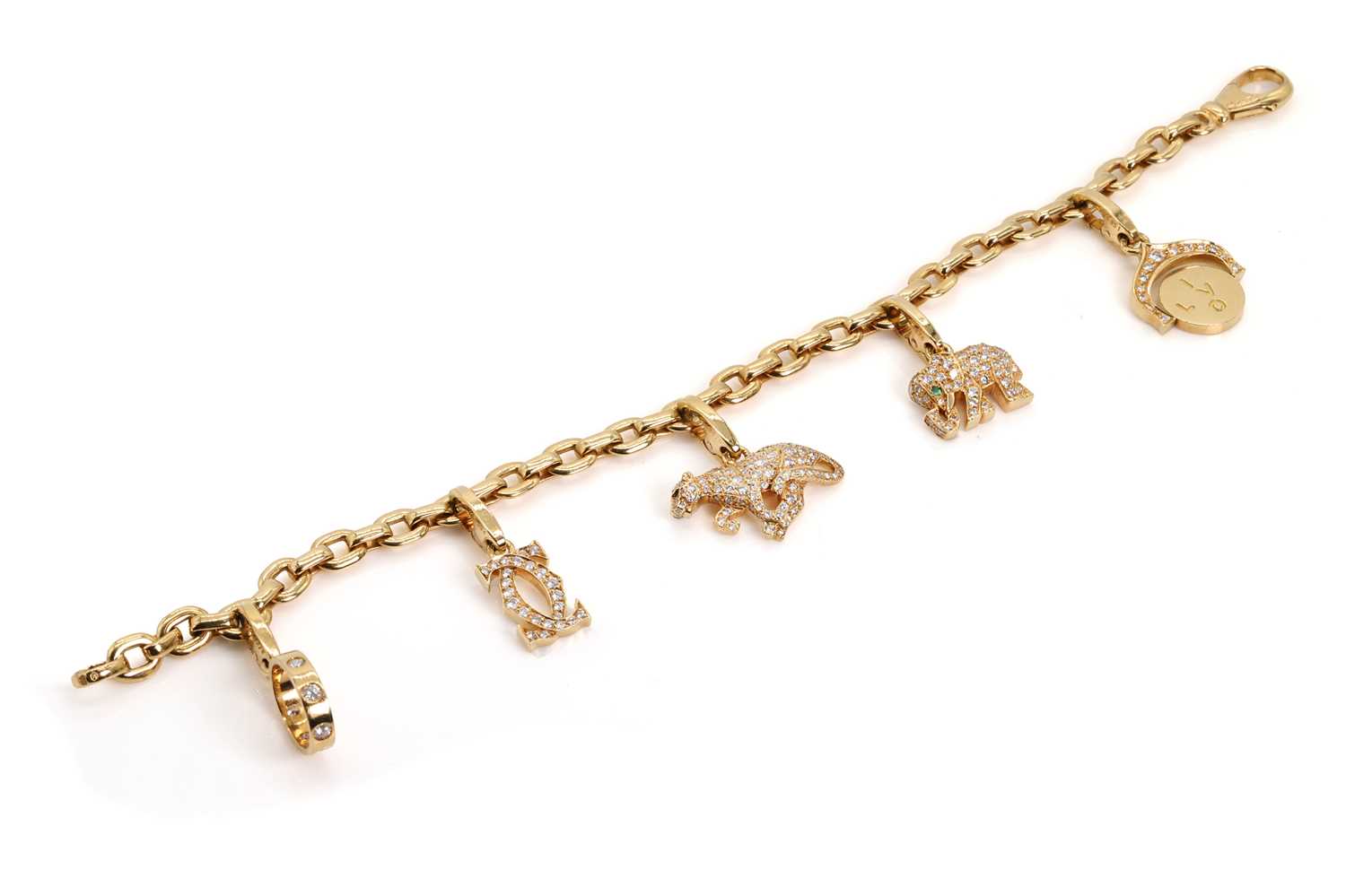 Lot 170 - An 18ct gold diamond charm bracelet, by Cartier