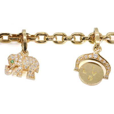 Lot 170 - An 18ct gold diamond charm bracelet, by Cartier