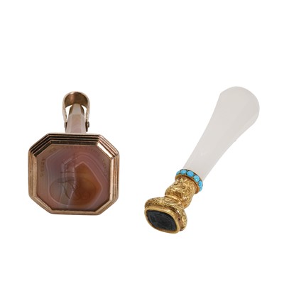 Lot 304 - An agate fob seal together with a desk seal, 19th century