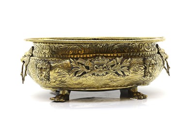 Lot 452 - An embossed brass wine cooler