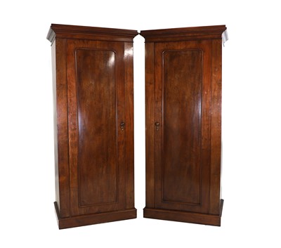 Lot 645 - A pair of mahogany wardrobe pedestals