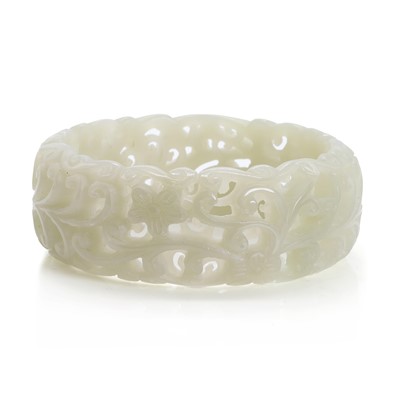 Lot 1280 - A carved nephrite pierced bangle