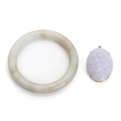 Lot 1281 - A jadeite bangle and a lavender jadeite brooch/pendant