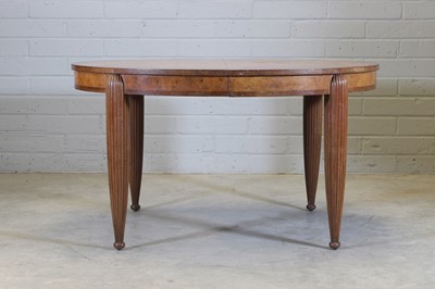 Lot 135 - A French Art Deco walnut and mahogany dining table