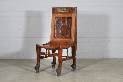 Lot 722 - An 'Egyptomania' brass-mounted stained beech chair