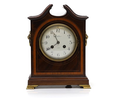 Lot 388 - An Edwardian mahogany crossbanded mantle clock