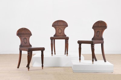 Lot 164 - Three Regency mahogany hall chairs