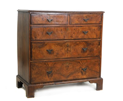 Lot 647 - A George III walnut chest of drawers