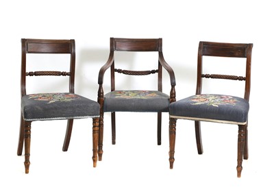 Lot 395 - A mahogany elbow chair and pair of dining chairs