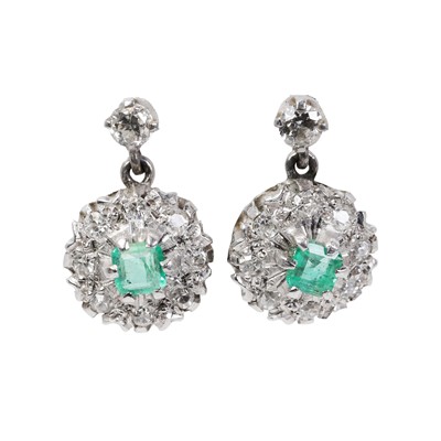 Lot 1181 - A pair of white gold Emerald and diamond drop stud earrings