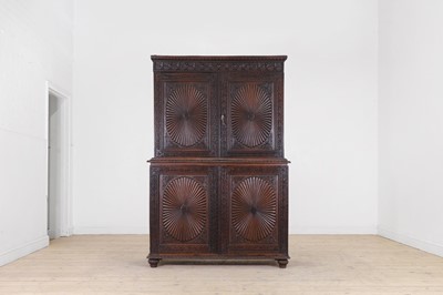 Lot 341 - A carved padouk linen press