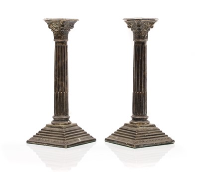 Lot 9 - A pair of silver candlesticks