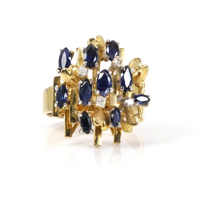 Lot 1146 - An abstract sapphire and diamond dress ring