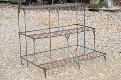 Lot 775 - A metal three tier plant stand