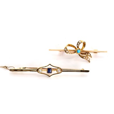 Lot 1052 - An Edwardian turquoise and split pearl bow form bar brooch