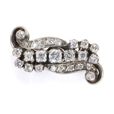 Lot 81 - A diamond set scroll brooch