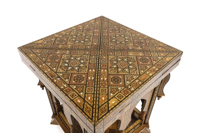 Lot 684 - A Damascus parquetry inlaid games table
