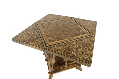 Lot 684 - A Damascus parquetry inlaid games table