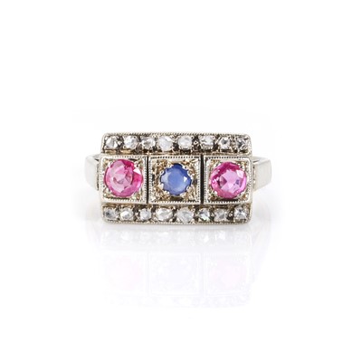 Lot 1163 - A three stone sapphire, ruby and diamond ring