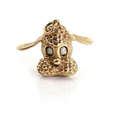 Lot 1075 - A novelty 9ct gold poodle head charm