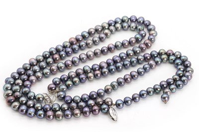 Lot 1257 - A three row baroque grey pearl necklace