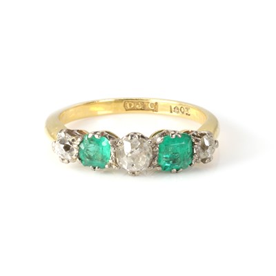 Lot 1039 - An emerald and diamond five stone ring