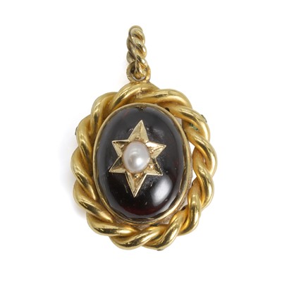 Lot 9 - A Victorian carbuncle garnet memorial locket pendant