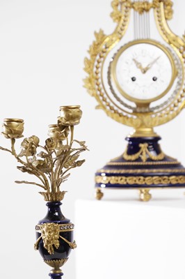 Lot 106 - A Louis XVI-style porcelain and gilt-metal clock garniture