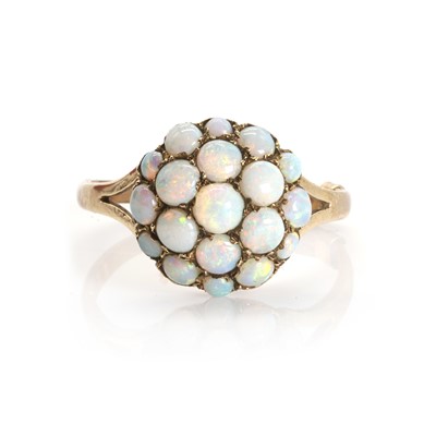 Lot 1071 - A 9ct gold opal bombé cluster ring