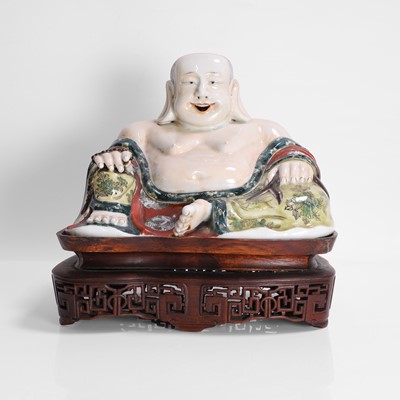 Lot 323 - A Chinese famille verte figure of Budai