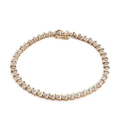 Lot 1138 - A 9ct gold diamond line bracelet