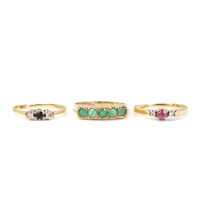 Lot 1325 - A group of three gold gem set rings