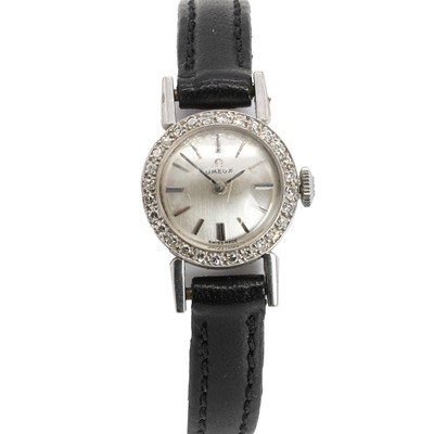 Lot 369 - A ladies' 18ct white gold diamond set Omega mechanical strap watch