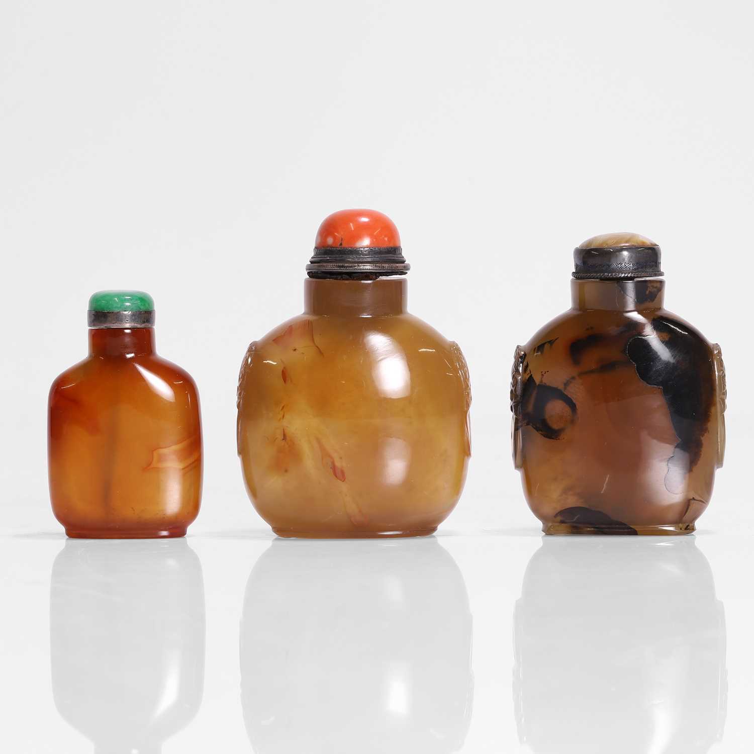 Lot 174 - A collection of three Chinese agate snuff bottles